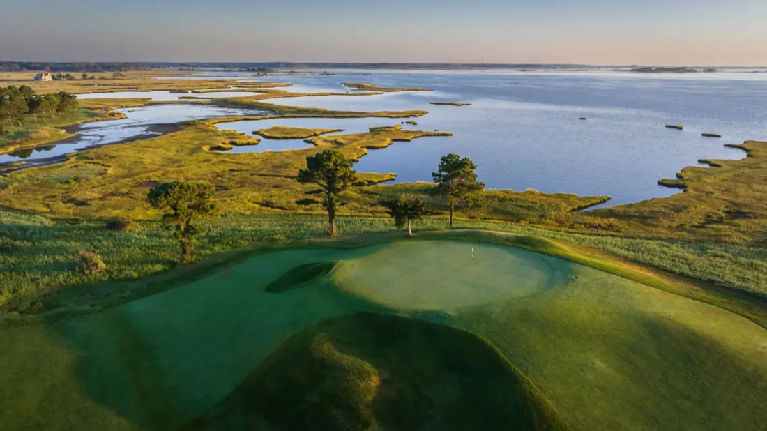 The Links at Lighthouse Sound — an aerial green over the marsh and bay toward the Ocean City skyline