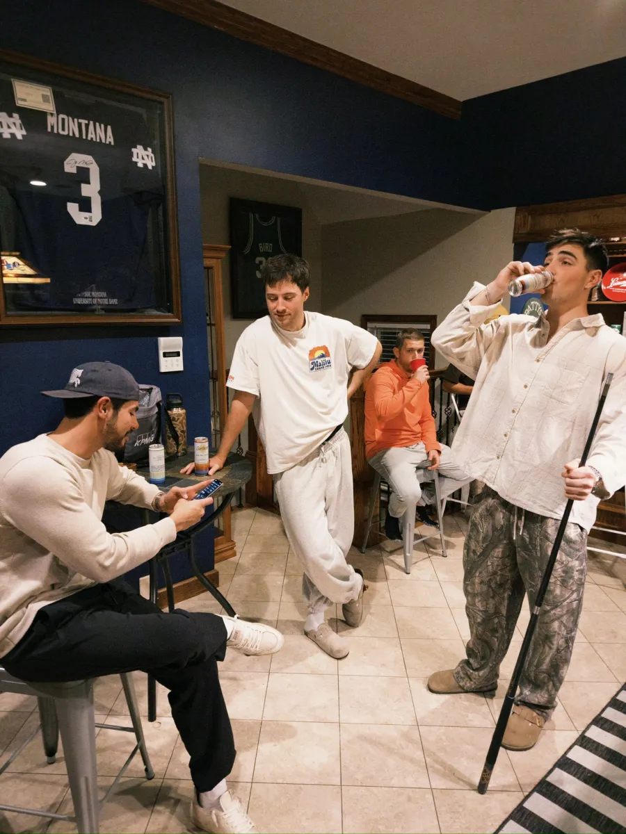 Regrouping in the basement bar, jerseys on the wall, a cold one in hand